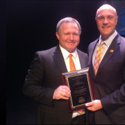 Andy Rollins accepting the Distinguished Public Service Award from Clemson's President