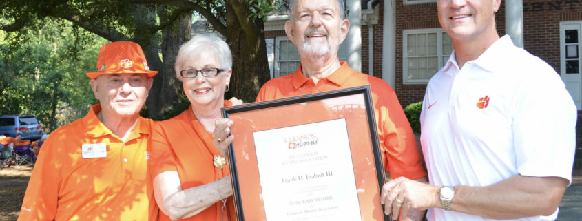 Frank Inabnit receives an honorary alumnus plaque from Clemson President James P. Clements