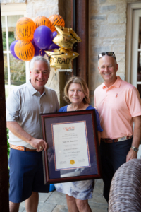 Kaye McElveen Stanzione poses with VP of Advancement, Brian O'Rourke and Clemson Alumni Board Chair, Jeff Duckworth