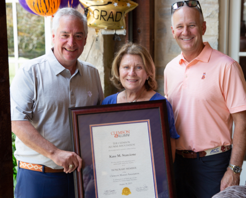 Kaye McElveen Stanzione poses with VP of Advancement, Brian O'Rourke and Clemson Alumni Board Chair, Jeff Duckworth