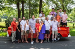 Kaye McElveen Stanzione  poses with her family as she is presented with the designation of Honorary Alumna of Clemson University