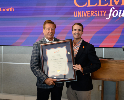 Dr John Alexander becomes an Honorary Alumnus