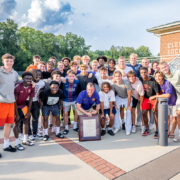 Coach Noonan celebrates being an Honorary Alumnus of Clemson with his team.