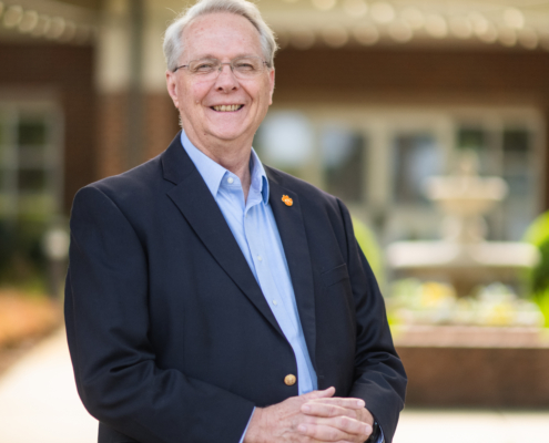 Boyd Parr standing in a courtyard