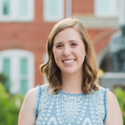 Katie Britton standing in front of Tillman Hall