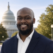 Joshua Smith smiling in front of the capital