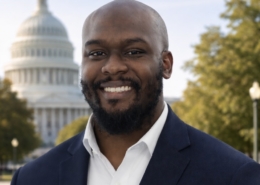 Joshua Smith smiling in front of the capital
