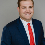 Professional headshot in corporate setting