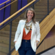 Professional headshot in front of staircase