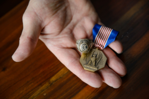 Moorehead with medal and Clemson ring