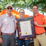 Wil Brasington recognizes Nancy Garrison as an Honorary Clemson Alumna