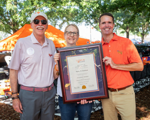 Wil Brasington recognizes Nancy Garrison as an Honorary Clemson Alumna