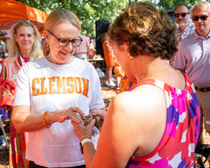 Nancy is presented with her Clemson Ring by Sharon Kingman